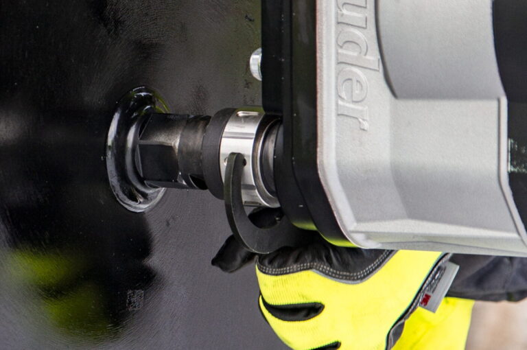 a core drill in action using a quick disconnect drill bit adapter.
